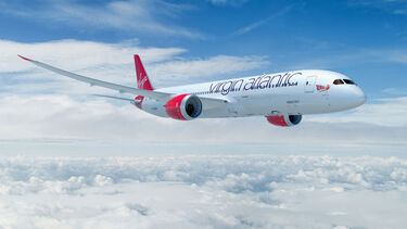 A Virgin plane flying above the clouds
