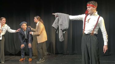 Samuel performing in a play.