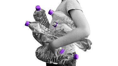 person holding empty water bottles