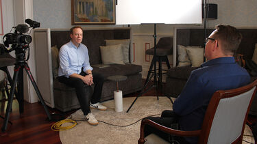 Documentary interview with two men facing each other
