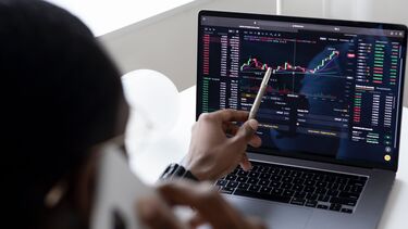 Person looking at data on a laptop