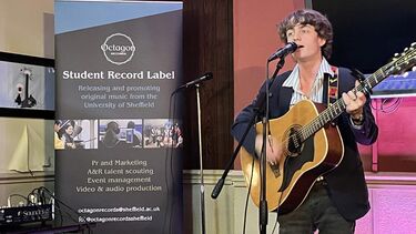 open mic night performance with singer and guitarist