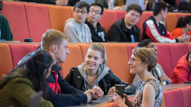 An academic talking to students in a lecture.