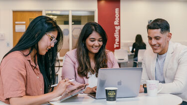 MBA students working together in cafe area