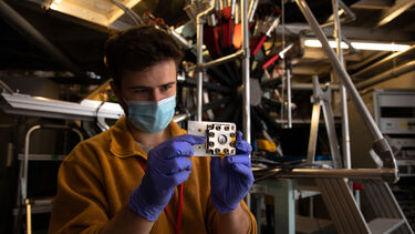 Dr Innes McClelland holding the sample cell