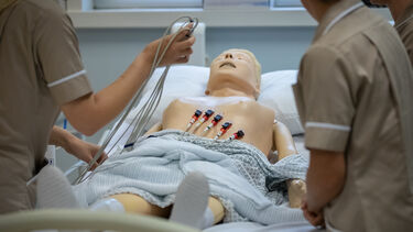 Students practicing on a mannikin