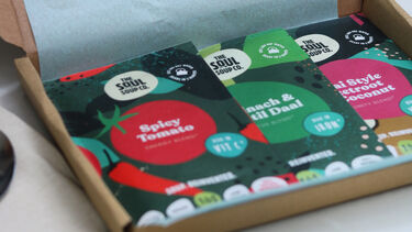 Brown box with soup packets in 