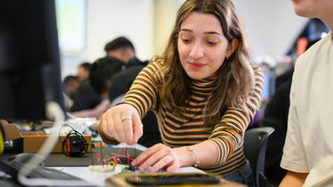 Student using an elvis board