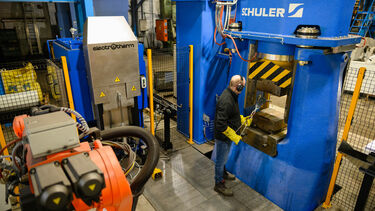 Richard Jewitt forges a hand tool on the Royce sponsored linear hammer at Footprint Tools