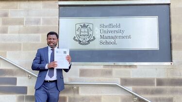 Godbless with his certificate.