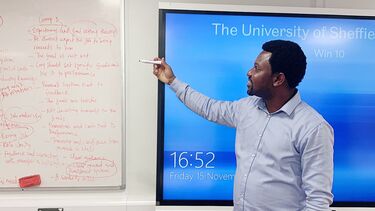 Godbless delivering a teaching session.