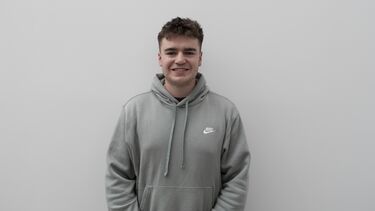 Tobias McNicol wearing a grey jumper.