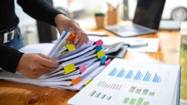 A person sorting out documents.