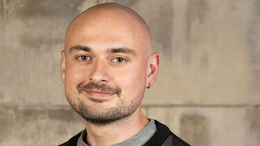 Photo of young man with a pleasant smile