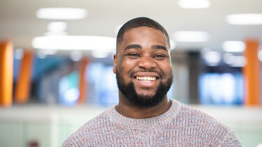 Sheffield male student smiling at the camera