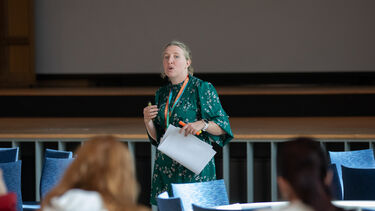 Liz Taylor delivering a presentation.