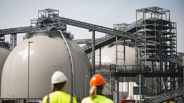 Two engineers looking at a Biomass dome at Drax power station