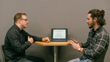 A student talking to a member of staff.