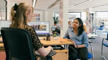 A student speaking to a member of the employability team.