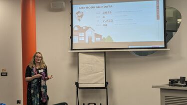 a speaker presenting slides