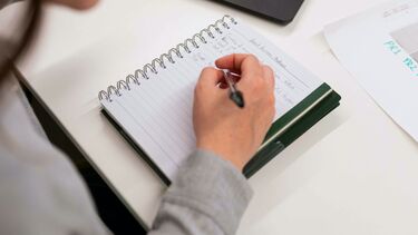 women looking at noteboook