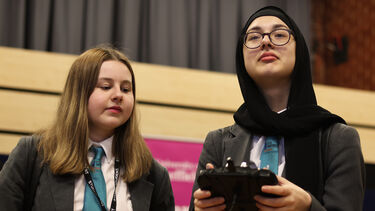 2 girls with a control panel