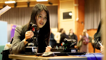 Girl using the flight simulator at STEM for girls 