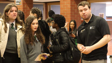 girls looking at the Sheffield Formula Racing car