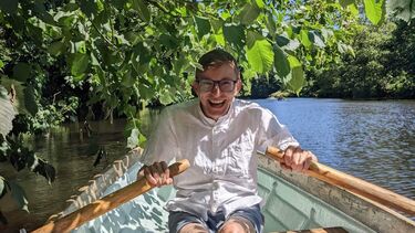 George rowing on a sunny day