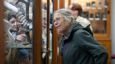 Lady looking into cabinet at event
