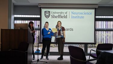 naomi hartopp receiving an award