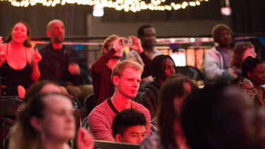 Group of people listening to an event 