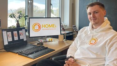 Business owner sat in front of computer for Homei