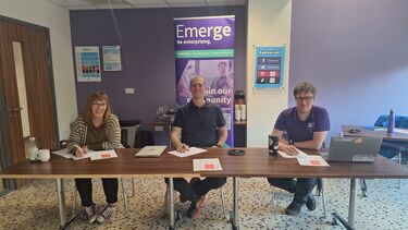 3 judges sat behind table