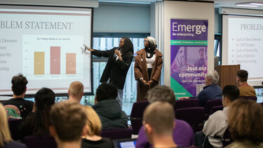 Business team presenting at the awards showcase in front of crowd