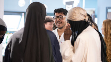 Group of students talking at event