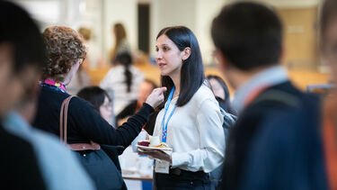 Atefeh Afsari talking to an academic colleague.