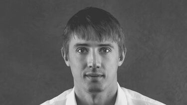 Black and white headshot of man
