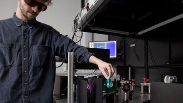 A student using chemistry equipment