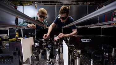 two students using scientific facilities