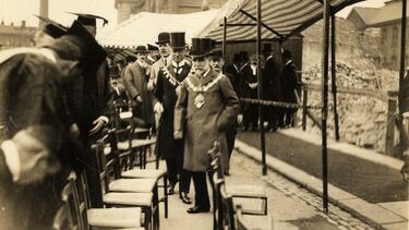 Academics and officials attending a ceremony for laying the cornerstone of the University of Sheffield.