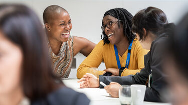 Staff laughing in a workshop