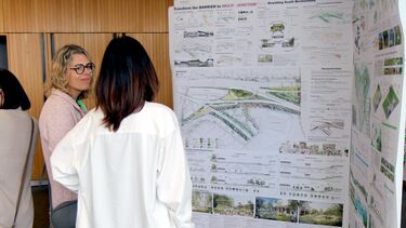 People viewing PGT students design work at the 2024 exhibition in the arts tower
