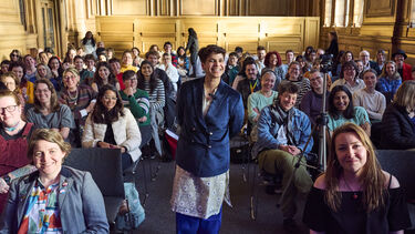 View of crowd sat in chairs 