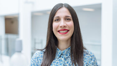 Atefeh Afsari wearing a blue floral shirt.