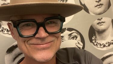 Dan in a hat smiling