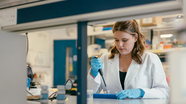 Rachel is using a pipet to transfer a liquid.