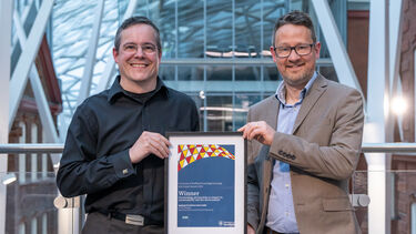 members of the team collecting the award on behalf of Dr Will Sloan