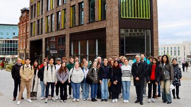 Students from PlanSoc in front of a new building in Sheffield city centre