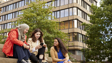 Students talking on the City Hall steps